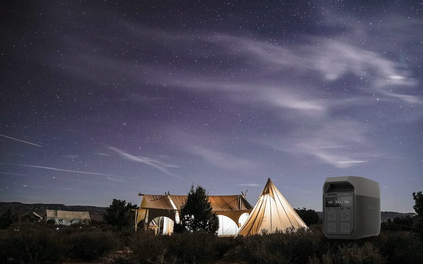 Illustrative scene: an EcoFlow DELTA 3 on dry ground beside glowing tents under a star-filled sky.