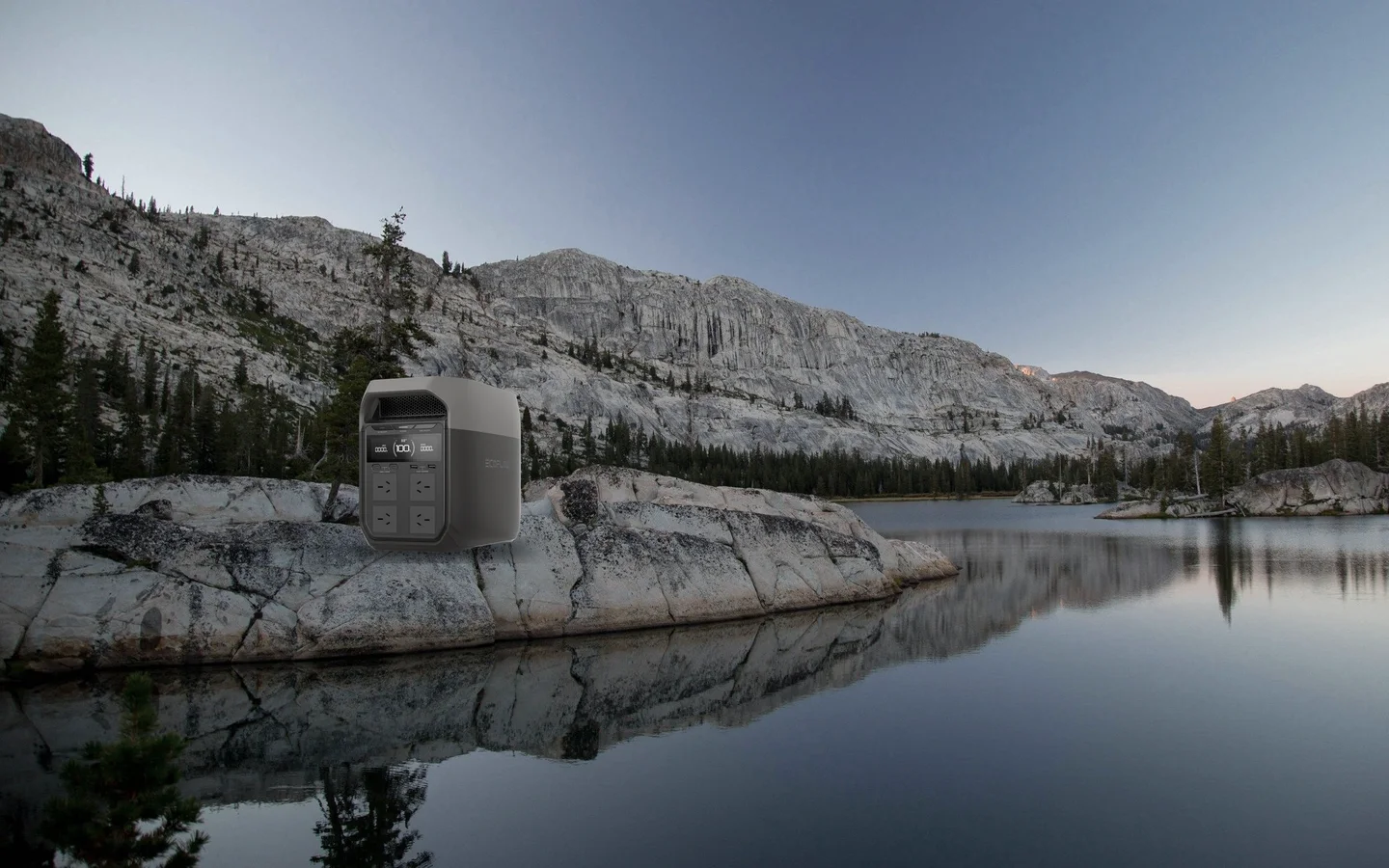 Illustrative scene: an EcoFlow DELTA 3 on a dry lakeside rock in the first light of morning.